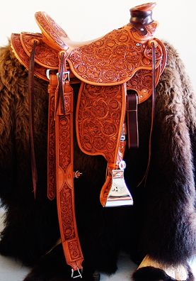 Advanced Sheridan Style Full Floral - Douglas 38 Wade by Keith Valley This wade saddle won the Don King Memorial - Open Advanced Sheridan Style Division. Specs: Douglas 38 Wade Tree - by Rick Reed 93 degree Bars 16 inch seat 7/8ths flat plate riggin 4 & 1/2 inch Stainless Steel Stirrups - tooled inside Cantle is 4 &1 /2 inches hight X 12 & 1/2 inches wide 1 & 3/4 inch tooled Cheyenne Roll All Stainless Steel Hardware - By Harwood Rope Strap and Choker Dee's are optional Santa Barbarbra Twisted Stirrup Leathers Tooled Back Cinch